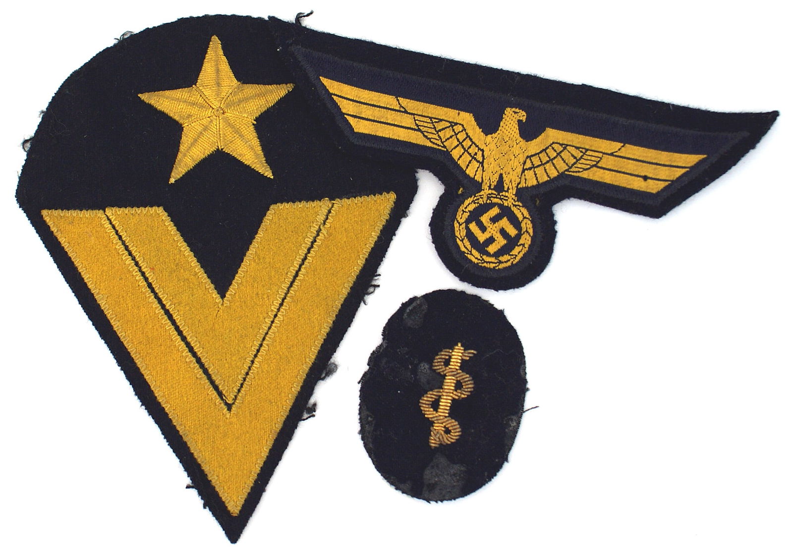 3 German WWII Navy cloth insignia eagles: H-040 Lot of 3 German WWII Navy cloth insignia: (1) Quality breast eagle. Gold silk eagle/swastika on a blue outline - on a blue cloth backing. Excellent. (2) Boatswain Obergefreiter. Large parachute