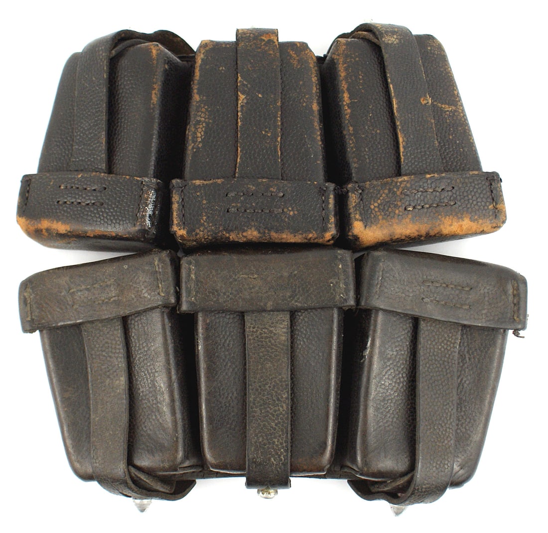 2 German WWII K98 cartridge pouches: M-007 Lot of 2 German WWII black leather K-98 pouches. Three compartment type with security straps belt loops. One has some scuffs. II