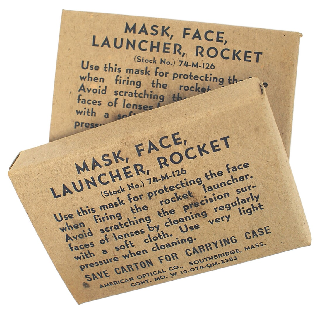 US WWII face mask rocket launcher: M-018 US WWII face mask to be worn "for protecting the face when firing the rocket launcher". A little-known accessory for personnel trained to use the bazooka. With the original cardboard pocket cart