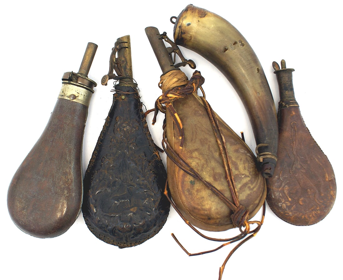 Five 19th Century antique shot/powder flasks: M-032 Lot of five 19th Century antique shot and powder devices: (1) 7 1/2" curved powder horn. Carved spout to allow for a suspension cord. Twisted iron eyelet on the wood plug. Shows some wear. (2) 8
