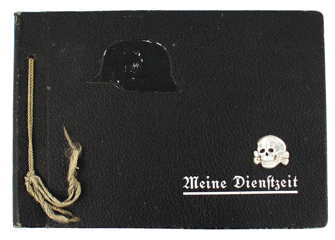 German WWII Waffen SS member photo album: L-008 "Meine Dienstzeit" Waffen-SS member used photo album. "Totenkopf" cap skull added to cover. 50 photos of training, relaxing in the field, at the staff company of the Waffen-SS, with comrades, SS