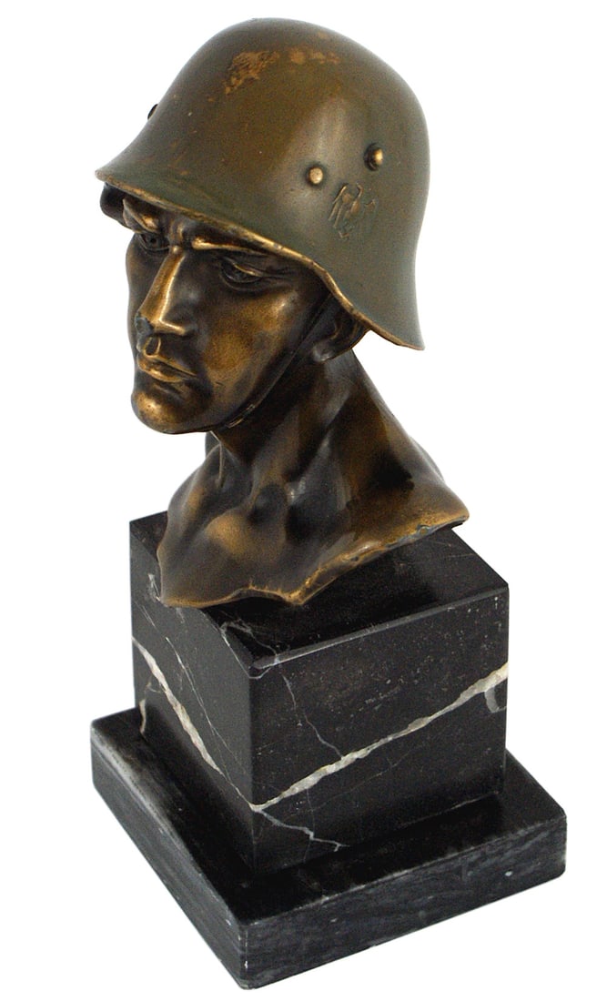 German WWII bronze soldier bust: G-016 German Third Reich bronze soldier bust. Helmeted stern looking subject wearing a double decal transition helmet. 4 1/2" x 5" bust is mounted on a two-piece marble pedestal. Overall 8 1/4" tall.
