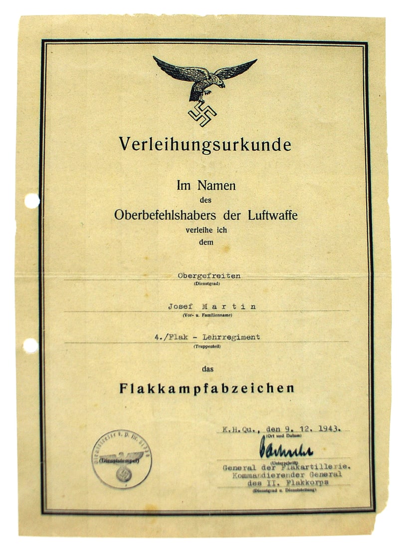 German Luftwaffe WWII citation Anti-Aircraft Badge: C-011 German Luftwaffe WWII citation for the Anti-Aircraft Badge. Awarded to Josef Martin of the 4th Flak Training Regiment. With a Feld-Post ink stamp of "51779" (General Command Flak Korps II). Ink 