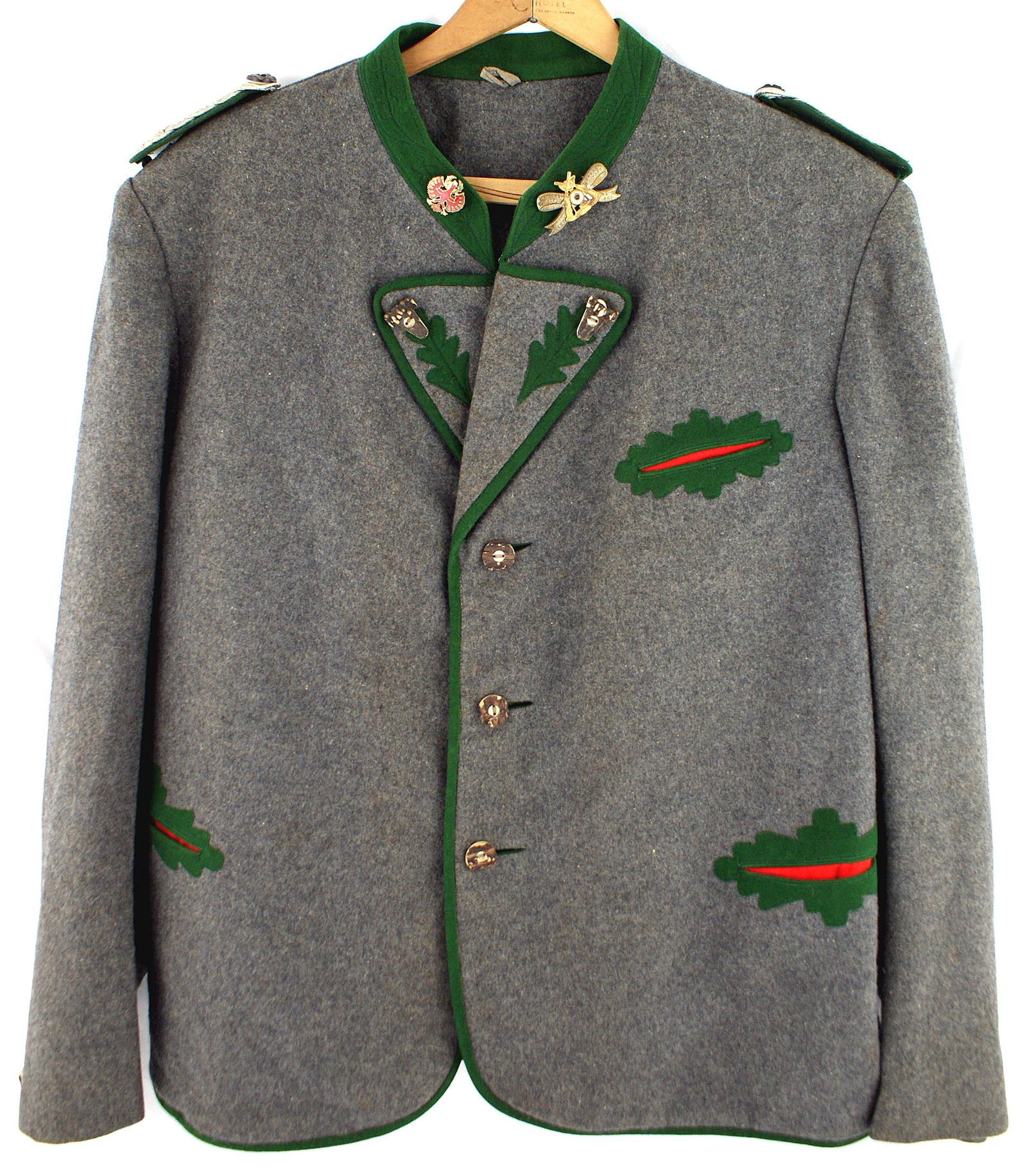German WWII Jagermeister blue-gray wool tunic: F-011 German "Jagermeister" blue-gray wool tunic. (Possibly left over Luftwaffe material.) Green collar with a red Silisian enameled eagle pin and a "ST. ROCHUS SCHUTZEN BRUDERSWAFT 1. COMP. ROTHGEN"