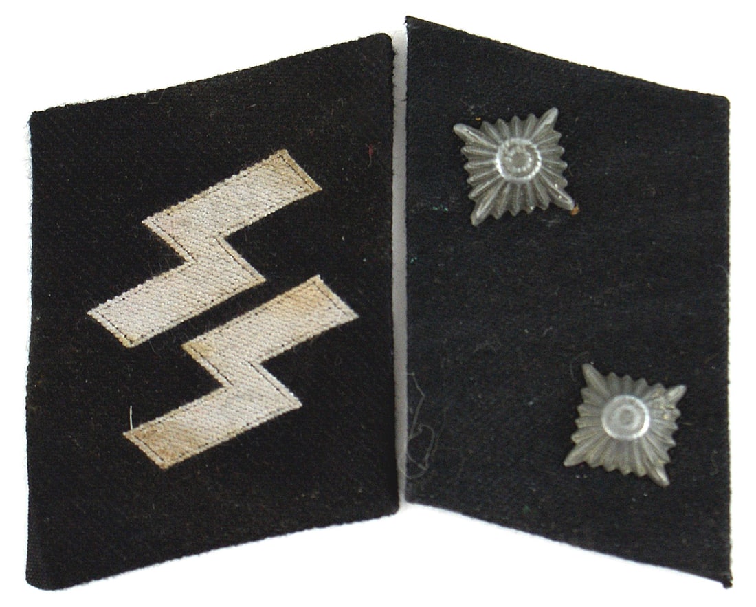 German WWII Waffen SS pair collar tabs: H-055 German WWII Waffen-SS pair of Oberscharfuhrer collar tabs: Right: SS silver runes (bevo style) on black. Left: two pips on black. Two different backings. II