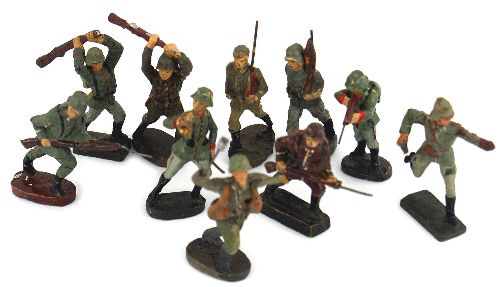 10 German WWII ELASTOLIN toy soldiers: H-083 Lot of 10 German Third Reich Period "ELASTOLIN" toy soldiers. All show some wear and four have chips. II-