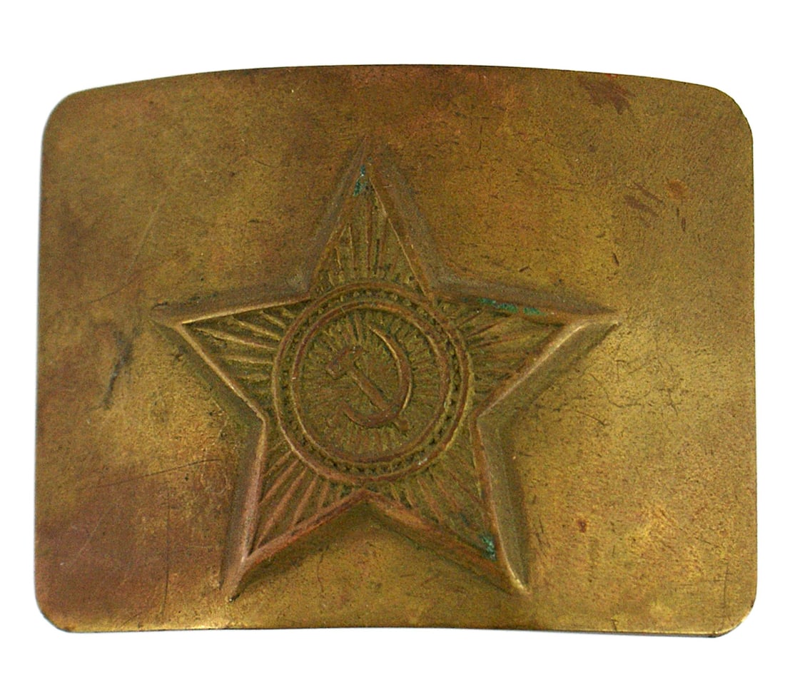 Soviet Russian Army belt buckle: H-137 Soviet Russian Army belt buckle. Large relief star with a hammer and sickle mounted on a convex all brass backing. Reverse has a tongue and rectangular device with a roller bar. Possibly WWII. I