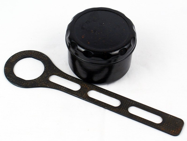 German WWII Lot Bakelite container/tool: M-44 Lot: (1) Bakelite container to hold grease for the MG 34/42. Maker's logo/"HK" on bottom. (2) K98 spanner tool for the grenade pouch. II