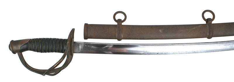 U.S. Civil War M1860 cavalry sword: K-19 M1860 cavalry sword. Age darkened patina on the brass pommel cap and three-branch guard. Braided wire wrapped leather grip. 34 3/4" curved blade is dated "US....1865". Also marked "EMERSON + LAMB