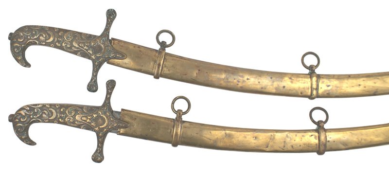 Pair Ancient Arabic Order of Mystic Shrine swords: K-72 Pair of Ancient Arabic Order of the Nobles of the Mystic Shrine dress swords. One-piece brass Mameluke style handle with a turned-down "beak" pommel and crossguard with relief floral work, cresce