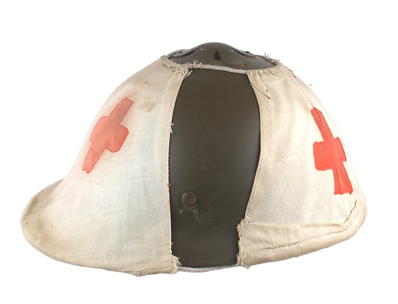 Japanese WWI period Adrian style helmet: E-73 Japanese WWI period "Adrian" style helmet. Original brown finish with a five-pointed metal star on front. Relief metal five-petal "flower" - with openings between petals, which act as a vent. Thr
