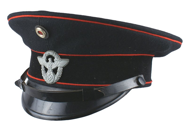 German WWII Fire department peaked cap: E-147 German WWII Fire department peaked cap. Black wool body, black velvet band and red piping. Police eagle/swastika/wreath badge and rosette. Black leather chinstrap. Brown leather sweatband. "...E