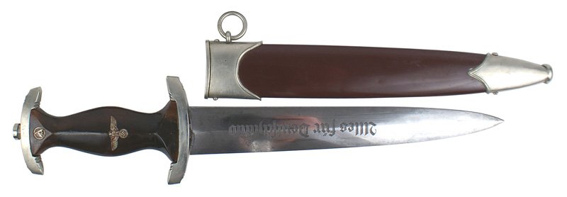 German WWII SA dagger: D-3 German WWII SA dagger. Patina on eagle in grip. Lower crossguard marked "NS" (Neider Saxon). Light gray patches on the blade. Logo of a hand holding a cup and "F. ED. OHLIGER - SOLINGEN". A rare m
