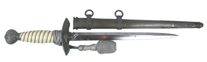 German WWII Luftwaffe 2nd Model dagger: D-21 German WWII Luftwaffe 2nd model officer's dagger. Age toned swastika/oak leaf pommel and flying eagle/swastika crossguard. Braided silver wire wrapped white grip. Silver bullion portopee. 10" has