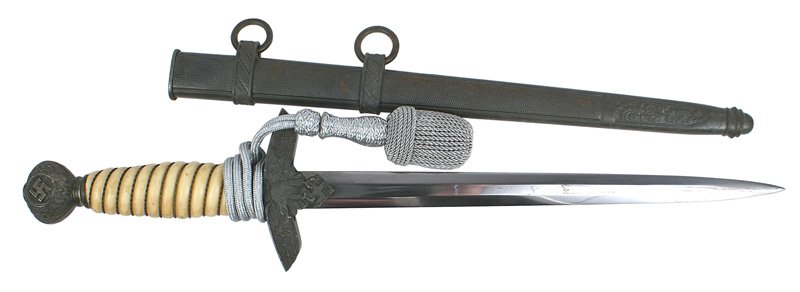 German WWII Luftwaffe 2nd Model dagger: D-22 German WWII Luftwaffe 2nd model officer's dagger. Wire wrapped age toned white grip. Dark patina on the pommel and crossguard. Silver bullion portopee. About excellent unmarked blade. Dark patina