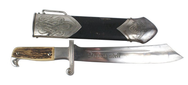 German WWII RAD M1934 hewer dagger: D-31 German WWII RAD (Labor Corps) M1934 hewer dagger. Nickeled "beak" and crossguard with stag horn grips. Wide 9 5/8" scimitar blade shows some graying. Engraved with the Labor Corps motto "Arbeit A