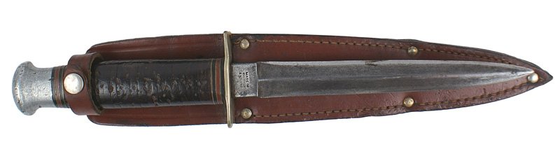 British made WWII combat knife: D-46 British made WWII combat knife. Leather rings grip and aluminum pommel (similar to the US PAL knife). 5 1/2" double edged blade marked "WILLIAM ROGERS..." AND "...SHEFFIELD ENGLAND". Shows wear a