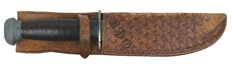 U.S. WWII combat knife: D-60 U.S. WWII combat knife. Smooth darkened leather rings grip with an oval metal pommel. Ka-bar type clean 6 1/4" blade marked "RH - PAL - 36". Custom simulated "basket weave" leather scabbard with 