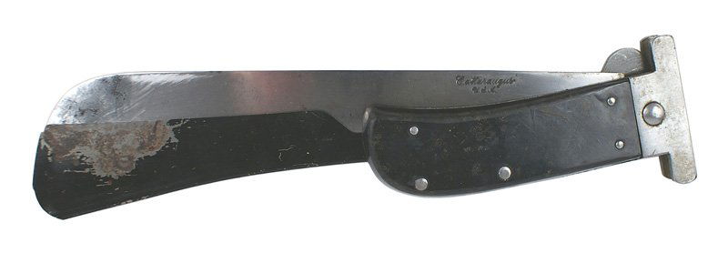 U.S. WWII Army Air Force survival knife: D-67 U.S. WWII Army Air Force survival knife. Folding machete type blade with flat polished black wood carved grips. Steel crossguard with a hinge which allows a 10" machete blade to be folded across