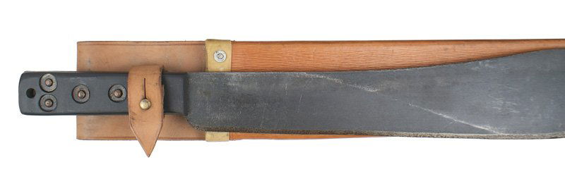 British WWII military machete: D-74 British WWII military machete. 2 3/4" wide darkened 14 3/4" blade - marked with a logo, "MARTINDALE", a broad arrow and numbered. Five brass rivets on the wood grips - marked with a broad arrow a
