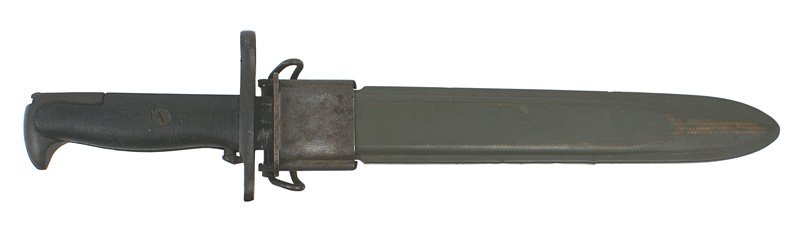 U.S. WWII Garand bayonet M1942 bayonet: D-149 U.S. WWII Garand bayonet M1942 bayonet. Darkened fittings and black plastic grips. 10" parkerized blade was sharpened. Maker marked "U.F.H. - U.S. - 1943". Green fiber scabbard with a metal thro