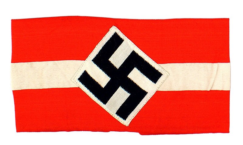 German WWII Hitler Youth armband: H-34 HJ (Hitler Youth) armband. Bevo embroidered black swastika on a white diamond - sewn to a red band with a 1" white stripe. II