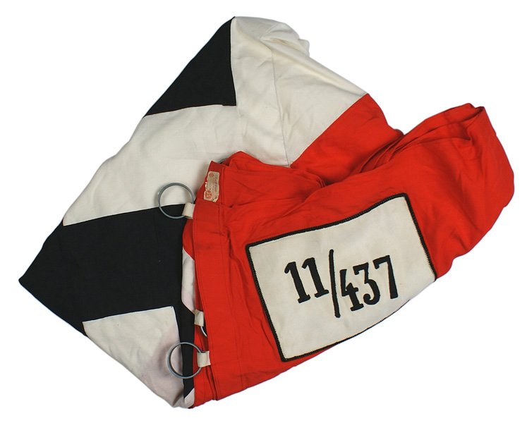German WWII Hitler Youth standard flag: H-174 Hitler Youth "Gefolgschaftsfahne". Large black tilted swastika sewn on a large white diamond which is sewn over the red field with a 15" wide center white stripe. Black cord piped 5 1/2" x 7 7/8
