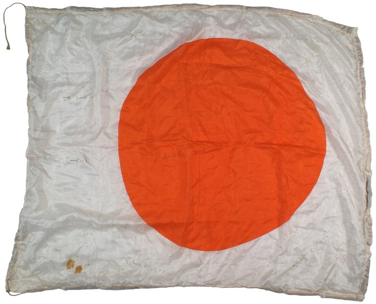 Japanese WWII meatball flag: H-235 Japanese "meatball" flag. Inked good luck slogans in Japanese characters. Two American GI's have added their names and addresses after capturing it. Some blood stains. Cord ties in corners. 31 1