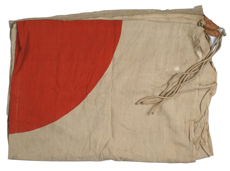 Japanese WWII Garrison meatball flag: H-239 Japanese Garrison "meatball" flag. Printed red center on an age toned white field. Leather tabs with rope ties in two corners. 58" x 76". Some wear on the far corners. II