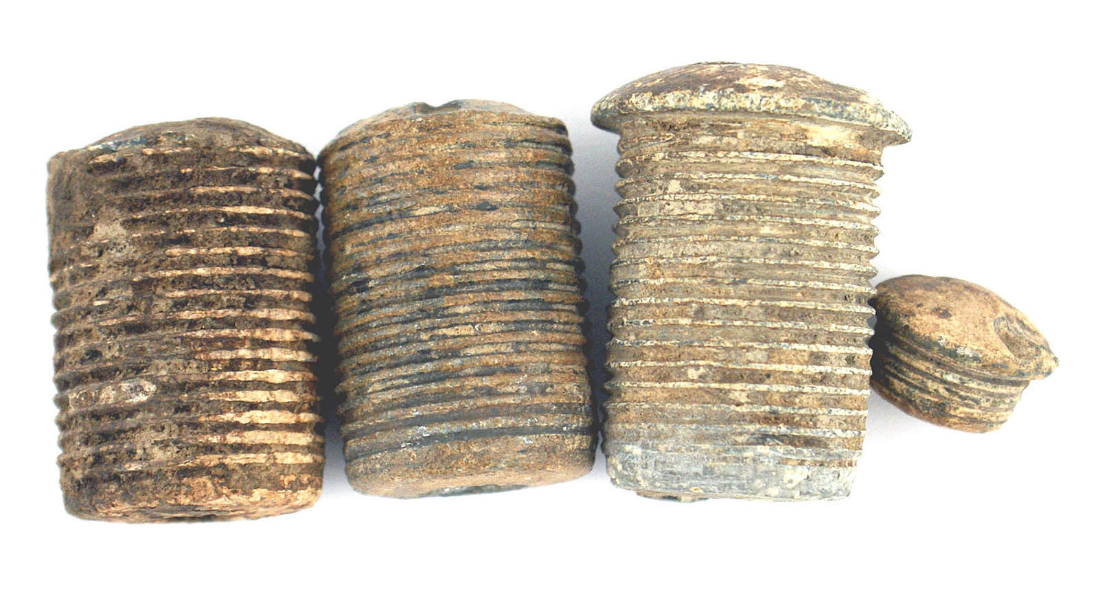 3 unknown Civil War Federal artillery fuzes: K-062 Lot of 3 unknown Federal artillery fuzes: (1) 1 5/8" tall threaded post with a 1" diameter. Top is slightly slanted. 1/2" diameter opening. (2) Two others similar to above but slightly smaller. 