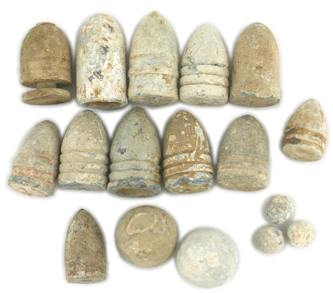 14 Civil War bullets excavated from battlefield: K-072 Lot of 14 Civil War bullets, acquired from various battlefields. Some show evidence of striking an object, being extracted from trees, being wormed or excavated. These are from a collection acqu