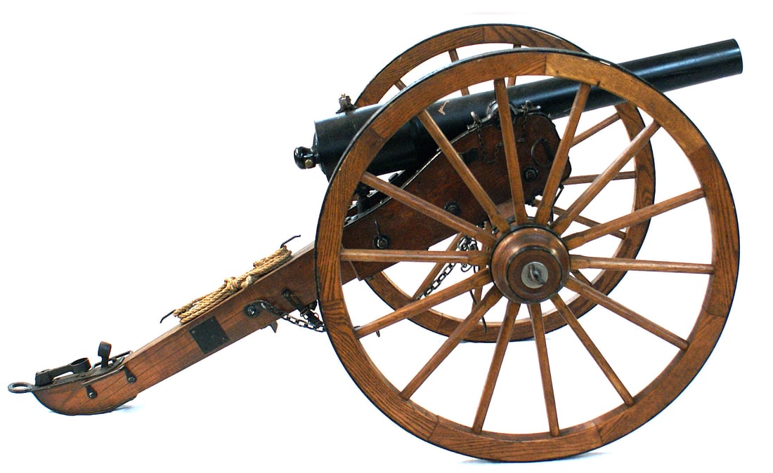 Copy Indian Wars Parrott rifle cannon: K-101 Copy of an Indian Wars 2" bore Parrott rifle (cannon). 35" barrel with a brass firing mechanism. Wood carriage built to specifications of the period. 30 1/2" diameter wood wagon wheels with a st