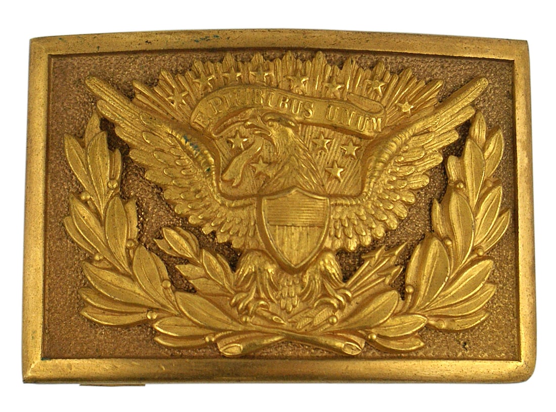 US officer belt buckle Circa Indian Wars to 1910: K-105 U.S. officer's custom belt buckle. Large spread wing eagle and a large laurel wreath are separate pieces all held in place by two loops and wire. Convex shape, excellent detail and a heavy gilt 