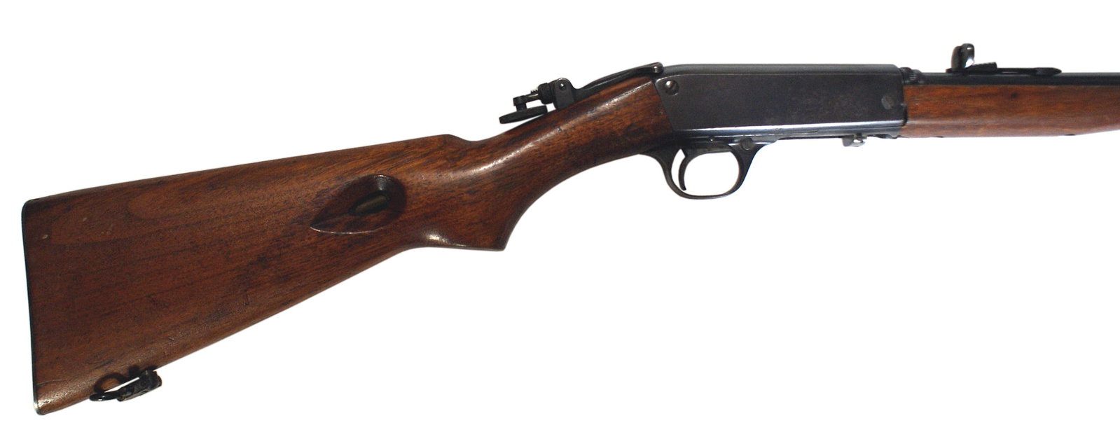 Remington Model 24 22LR rifle: M-031 Remington Model 24 22LR. SN#43724. Woodstock tube-fed semi-automatic bottom eject 22lr. Marked made in Ilion, NY. Bore is bright with some wear. Has a Lyman Rear Peepsight, along with the origin