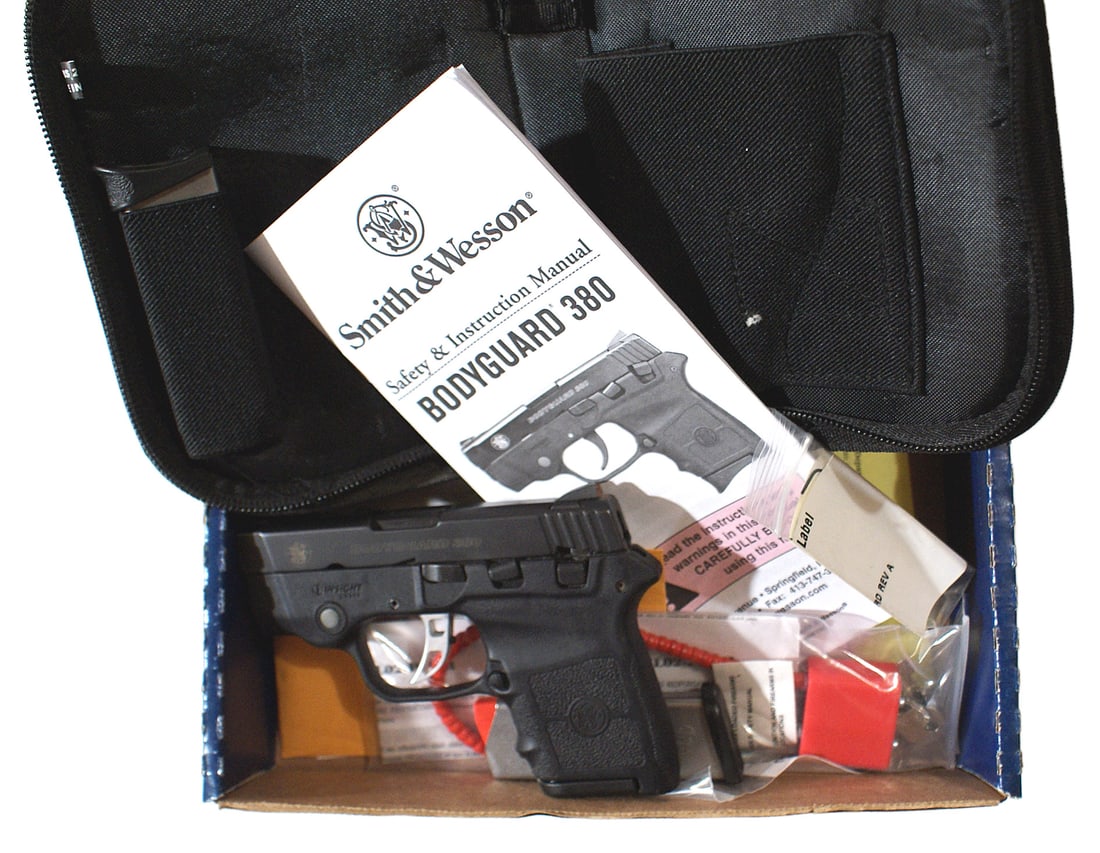 Smith & Wesson Bodyguard 380 auto pistol: M-042 Smith & Wesson Bodyguard 380 auto SN#KBX0873. smith and Wesson Bodyguard 380acp with box, carrying case, total of 3 magazines and a built in laser. Has manual safety and has an upgraded