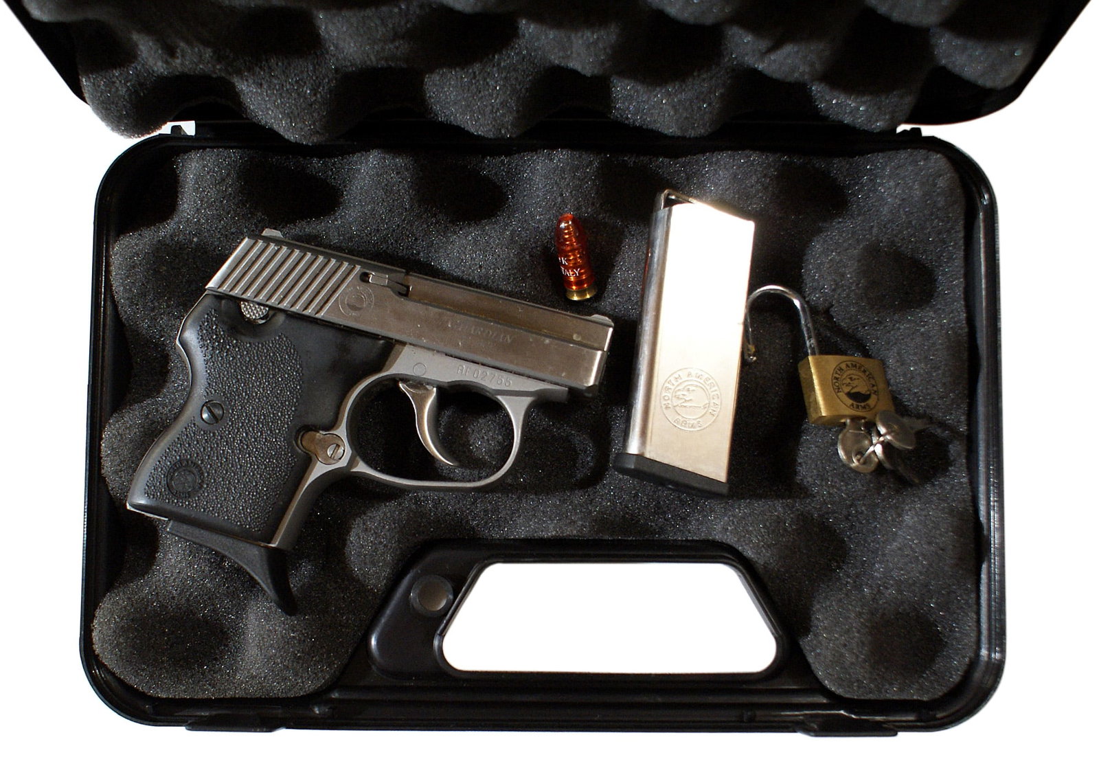 North American Arms Guardian 32 ACP pistol: M-044 North American Arms Guardian 32 ACP. SN#AF02755. The model is "Guardian". The caliber is 32 ACP. The firearm has one flush fit magazine and a spare with a pinky extension. The overall condition