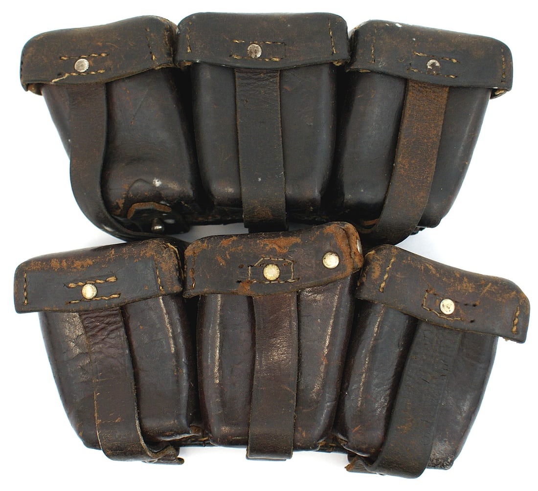 Polish cartridge boxes pair like German WWI: M-057 Pair of Polish three-compartment dark brown leather cartridge boxes. Same style as German WWI - with a large "D" ring and two leather belt loops. Inside of one lid stamped with a Polish eagle,