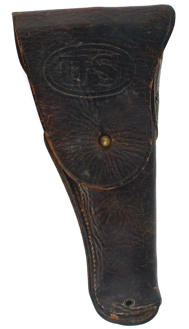 US WWI holster for the 45 cal 1911 pistol: M-061 U.S. WWI holster for the 45 cal. 1911 automatic pistol. Darkened brown leather with "U.S." embossed in an oval on the front flap. Belt hook on the back and marked "WARREN LEATHER GOODS CO. 1918"