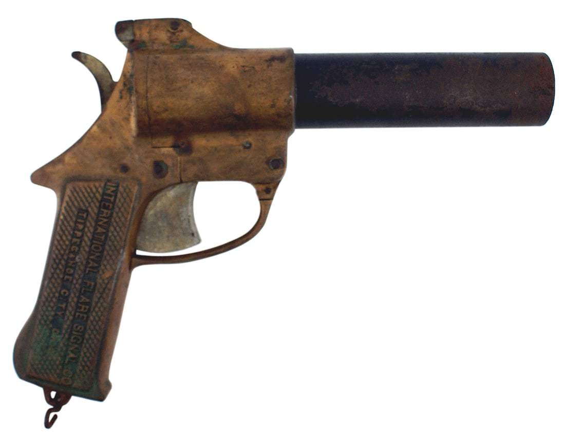 US WWII flare pistol SIGNAL: M-065 U.S. WWII flare pistol made all in brass except for the steel 5 1/4" barrel. Both grips have recessed brass lettering "INTERNATIONAL SIGNAL CO. TIPPECANOE CITY OHIO". Made in 1943. All the brass