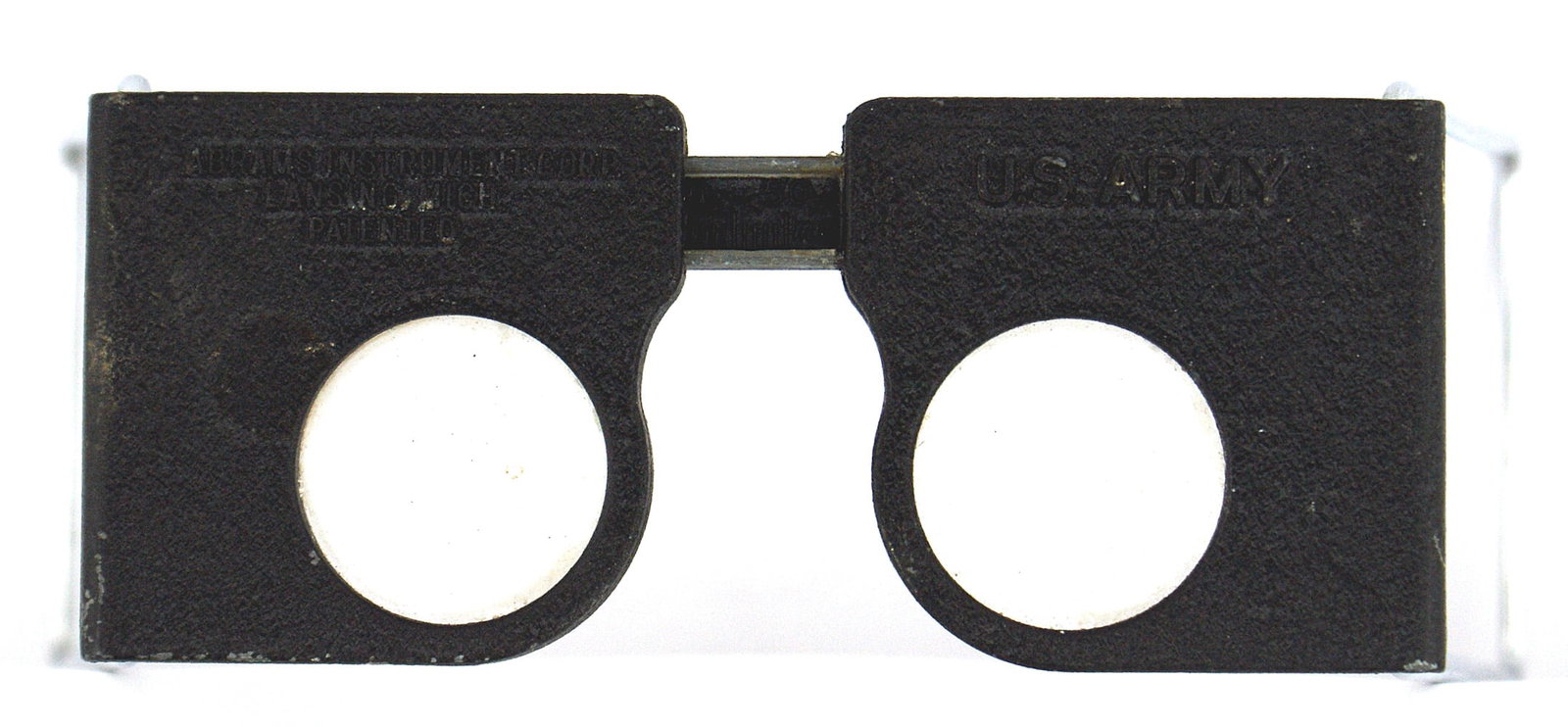 US Army WWII STEREOSCOPE ABRAMS INSTRUMENT: N-018 U.S. Army WWII STEREOSCOPE ABRAMS INSTRUMENT. Used for interpreting maps and aerial photos. 4 1/2" x 2" metal frame with "U.S. ARMY" and "ABRAMS INSTRUMENT CORP. - LANSING MICH. PATENTED". Two m