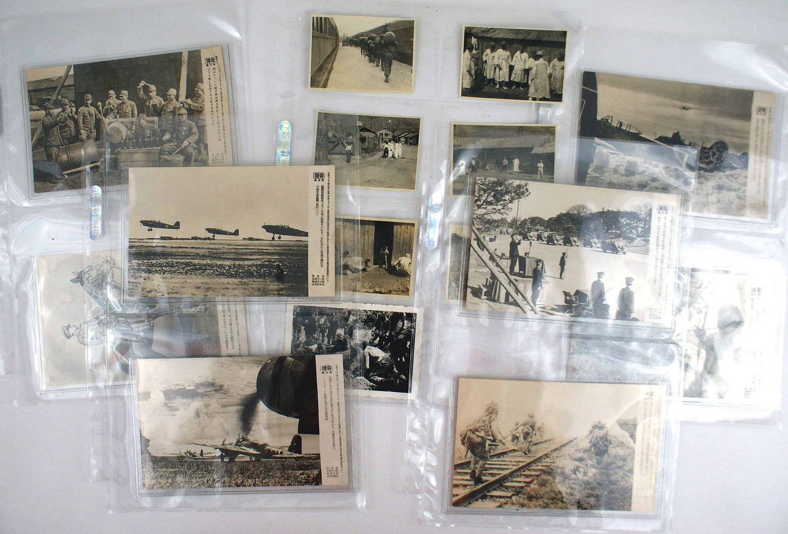 8 Japanese WWII photo postcards and photos: P-010 Lot of 8 Japanese WWII photo-postcards and 7 photos. Includes: (1) Photo-postcards - military review, combat troops, officer on horseback, bombers "taking off", etc. (2) Photo of Korean village.