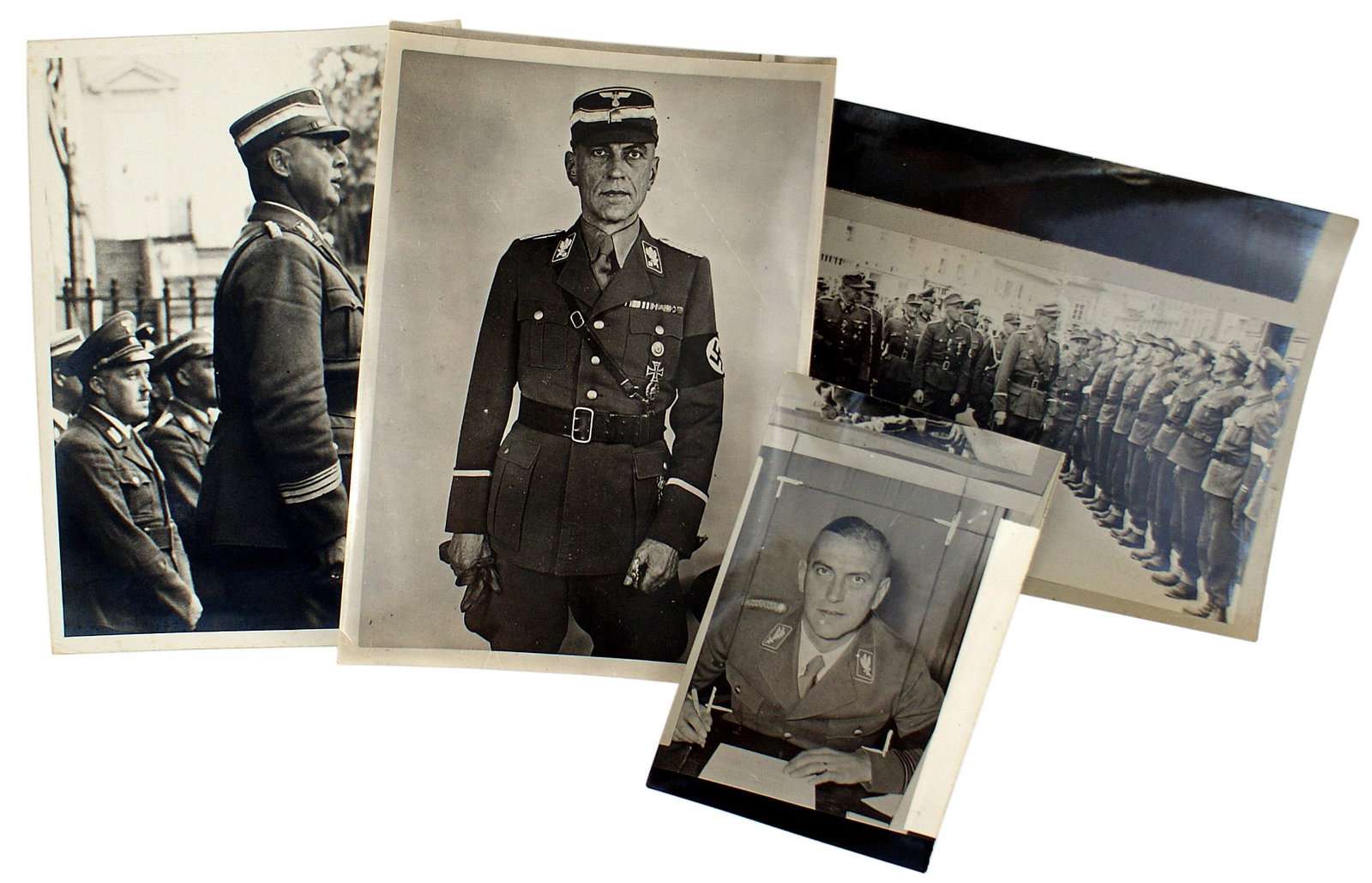 4 German WWII SA leader photos: L-009 Lot of 4 SA leader photos: (1) Group Alpenland Fuhrer Giessler addressing a gathering. 7 1/4" x 5 1/8" with typed I.D. label and studio stamping on reverse. (2) Three of Obergruppenfuhrer Juttne