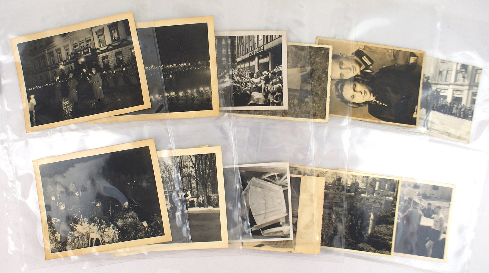 13 German WWII photos Prussian Police Goebbels: L-012 Lot of 13 German photos. Includes four 4 3/8" x 5 5/8" photos of the German Prussian Police and Goebbels at a night time event. Also a propaganda photo of two German children at their father's g