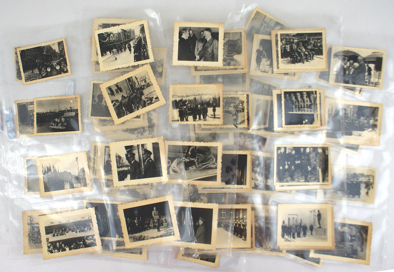 64 German WWII photos Hitler with troops Goring: L-013 Lot of 64 German photos which covers some of the major events of the Third-Reich. Includes: Hitler with troops on parade, Hermann Goring, Hitler with Mussolini, dignitaries, views of inmates in 