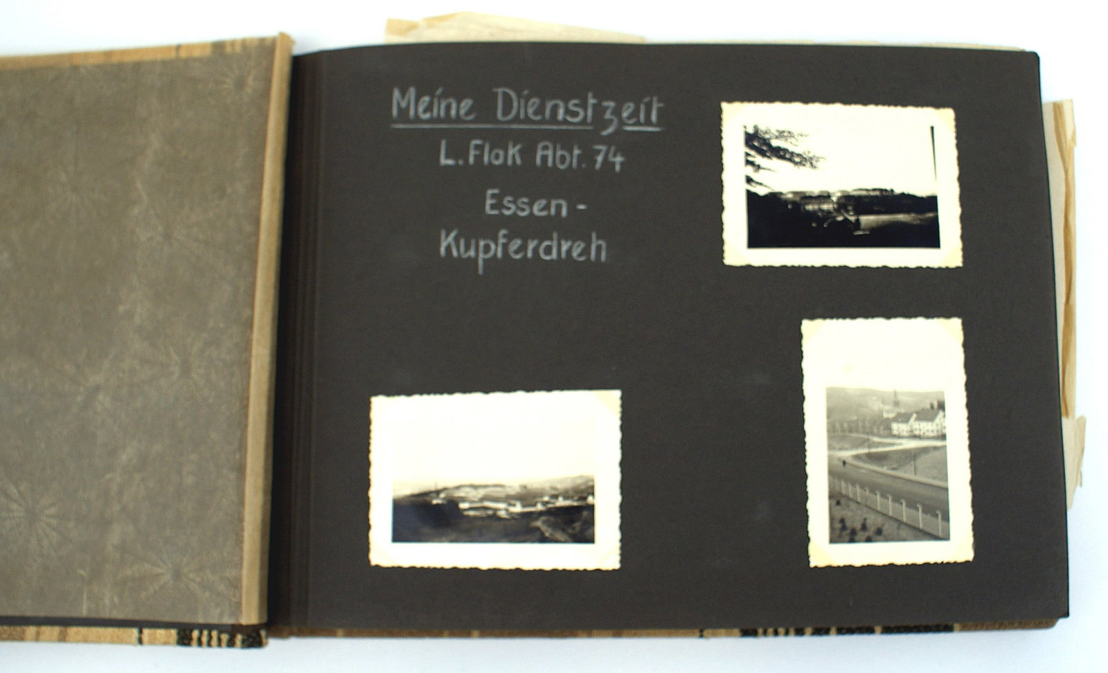 German WWII photo album Luftwaffe Flak Abt, 74: L-020 German WWII personal photo album of a member of Luftwaffe Flak Abt, 74 stationed in Essen-Kupferdreh. Most of the pages have a title and/or descriptions in white ink. Photos include: the kaserne