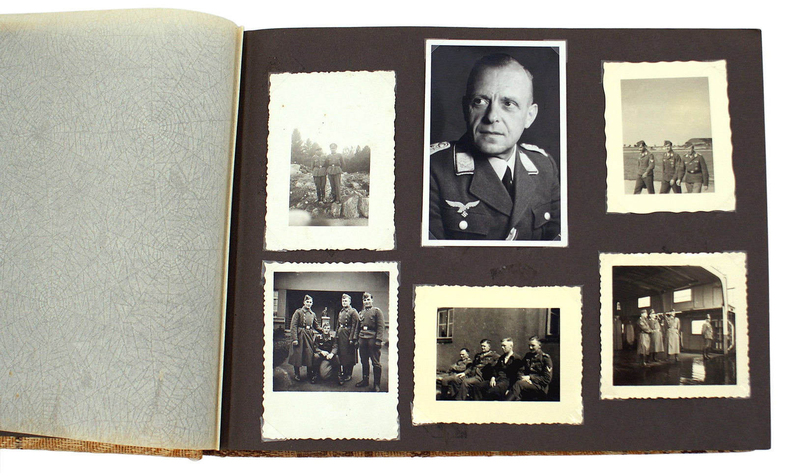 German WWII military photo album Luftwaffe: L-021 German WWII military photo album. Includes photos of a Luftwaffe Colonel, Luftwaffe personnel, views of historical buildings. RAD man at a market, target practice, views of a city in Greece, anc