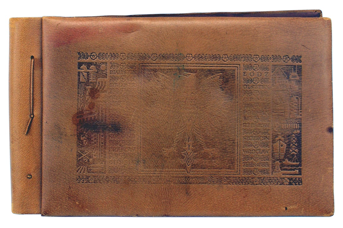 Polish post war unused leather photo album: L-029 Polish post-war unused leather photo album. Cover is embossed with a large Polish crownless eagle with the names of Polish cities and symbols of industry and commerce on both sides. 16 1/2" x 10