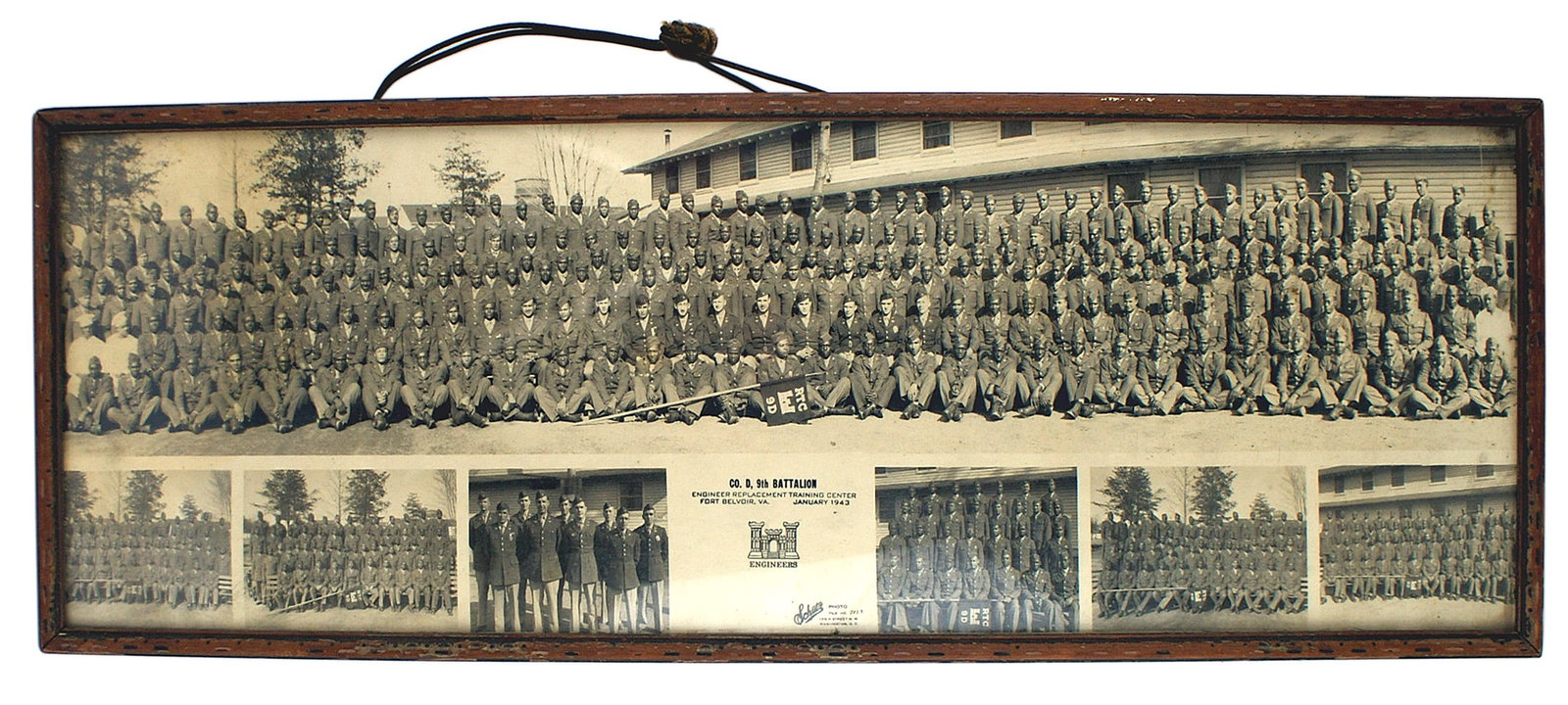 US Army WWII yard long photo of Company D 9th Battalion: L-035 U.S. Army WWII "yard long" photo of Company D, 9th Battalion. An all-black unit photographed at the Engineer Replacement Training Center Fort Belvoir, VA. -January 1943, 10 1/4" x 30 3/4" in ori
