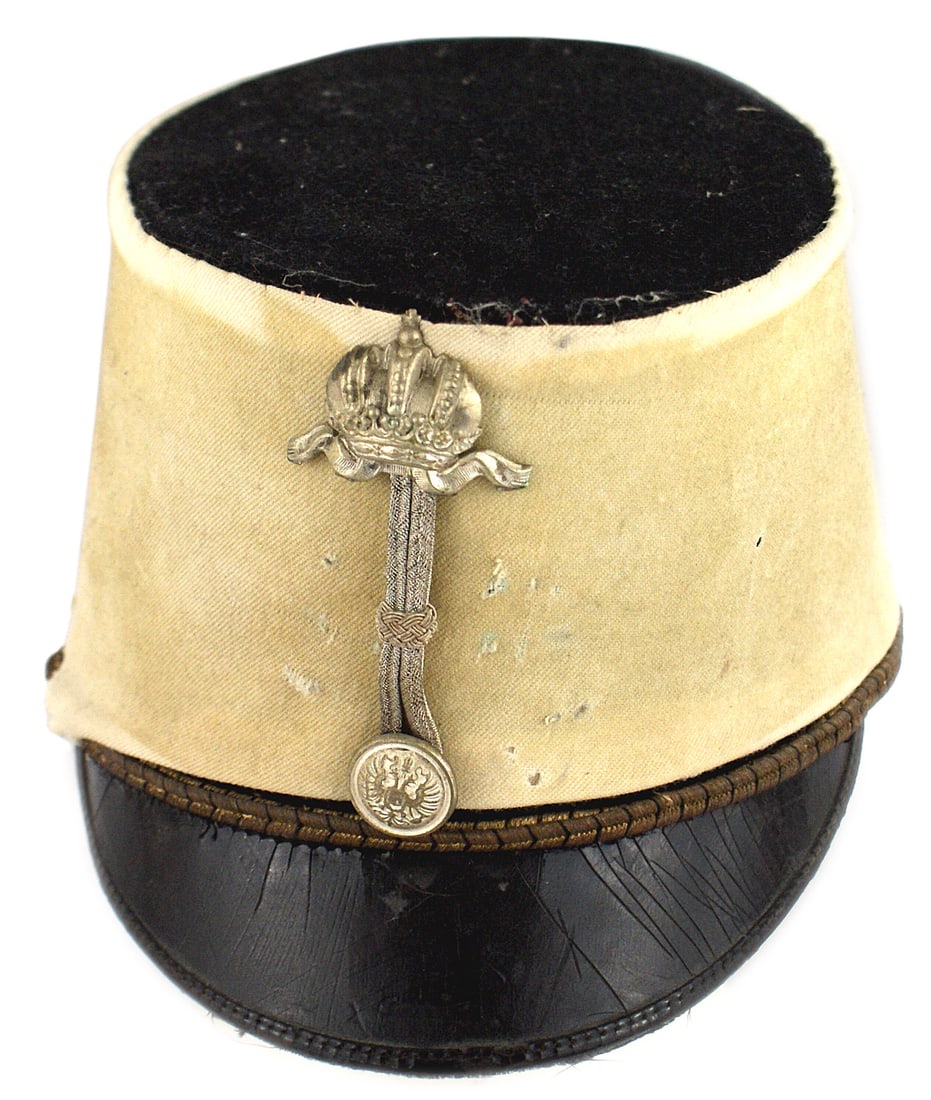 Imperial Austrian Dragoon officer cap: E-002 Austrian Dragoon officer's cap. Black wool body with a 1900 white maneuvers cloth cover. Insignia of Staff Judge - silvered double-headed eagle button, double vertical silver wire cord and a sil