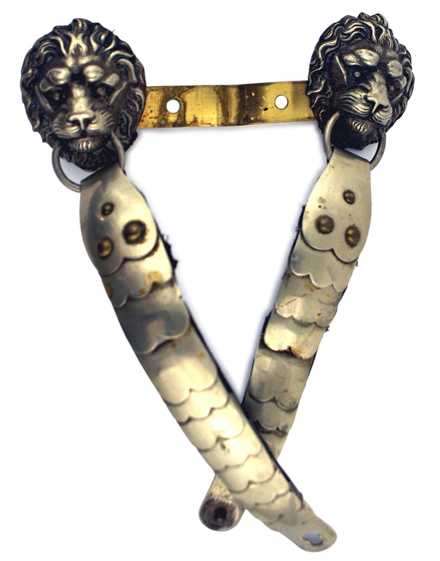 Bavarian spike helmet chinscales Police: E-016 Bavarian spike helmet chinscales. Silver lion-head bosses holding a ring with attached silver chinscales. Probably for a Police helmet. II